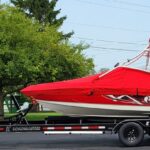 Customer boat trailer for a Mastercraft X30 and 3 standup jet skis