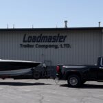 Pier 53 with powerboat on a Loadmaster Trailer hitched to a truck